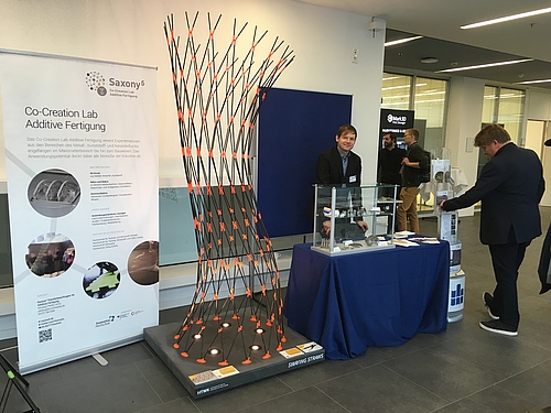 Stand des Co-Creation Labs Additive Fertigung auf der Kooperationsbörse des Forums 3D-Druck in der Anwendung.